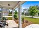 Charming front porch area with decorative seating, complemented by verdant landscaping and tree-lined street at 2953 Balvenie Pl, Acworth, GA 30101