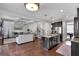 Open-concept living space showcases coffered ceilings, hardwood floors, and a seamless flow into the kitchen area at 2953 Balvenie Pl, Acworth, GA 30101