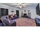 Entertainment room with comfortable seating, large television, recessed lighting and carpeting at 2953 Balvenie Pl, Acworth, GA 30101