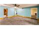 Spacious basement area featuring a blue painted walls, and access to other rooms at 433 Pearl St, Locust Grove, GA 30248