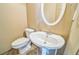 Bathroom featuring a pedestal sink and toilet with tile floor at 433 Pearl St, Locust Grove, GA 30248