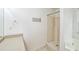 Bright bathroom features a stand-up shower with tile surround, and a stone countertop at 433 Pearl St, Locust Grove, GA 30248
