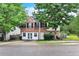 Charming two-story home with a brick facade and a lush green yard at 433 Pearl St, Locust Grove, GA 30248