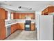 Spacious kitchen featuring stainless steel appliances and light wood cabinetry at 433 Pearl St, Locust Grove, GA 30248