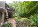 Beautiful backyard with a stone pathway leading to upper deck at 5049 Lake Ter, Marietta, GA 30068