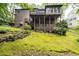 Spacious backyard featuring a multi-level deck, landscaped terraces, and lush greenery at 5049 Lake Ter, Marietta, GA 30068