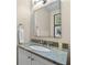 Bathroom featuring a granite countertop, modern mirror, and a stylish sink at 5049 Lake Ter, Marietta, GA 30068