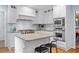 Well-lit kitchen featuring stainless appliances and an island with seating at 5049 Lake Ter, Marietta, GA 30068