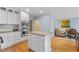 White kitchen island with stainless appliances and open floor plan at 5049 Lake Ter, Marietta, GA 30068