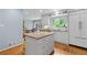 Kitchen featuring an island and stainless appliances with open space at 5049 Lake Ter, Marietta, GA 30068