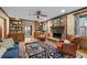 Cozy living room features a brick fireplace, wooden bookshelves, and comfortable leather chairs at 5049 Lake Ter, Marietta, GA 30068