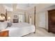 Bright main bedroom featuring a large bed, neutral colors, and ensuite bathroom access at 5049 Lake Ter, Marietta, GA 30068