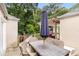 Outdoor deck featuring a wooden pergola over an outdoor dining set with seating for six at 711 Greenview Ne Ave, Atlanta, GA 30305