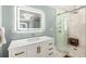 Modern bath featuring a glass shower, white vanity with gold hardware, and white marble floor at 711 Greenview Ne Ave, Atlanta, GA 30305