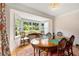 Formal dining room featuring hardwood floors, classic wainscoting, and abundant natural light at 711 Greenview Ne Ave, Atlanta, GA 30305