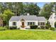 Charming home with a well-manicured lawn and lush landscaping at 711 Greenview Ne Ave, Atlanta, GA 30305