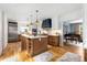 Open-concept kitchen with a large island, stainless steel appliances, and hardwood floors at 711 Greenview Ne Ave, Atlanta, GA 30305