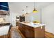 Gourmet eat-in kitchen boasts marble counters, wood floors, custom cabinets, and a large island at 711 Greenview Ne Ave, Atlanta, GA 30305