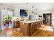 Bright eat-in kitchen with marble island, wood floors, custom cabinets, and modern appliances at 711 Greenview Ne Ave, Atlanta, GA 30305