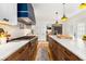 Gourmet eat-in kitchen boasts marble counters, wood floors, custom cabinets, and modern appliances at 711 Greenview Ne Ave, Atlanta, GA 30305