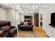 Open living room with coffered ceilings, hardwood floors, wet bar, and seamless flow to other spaces at 711 Greenview Ne Ave, Atlanta, GA 30305