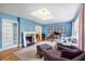 Elegant living room featuring fireplace, piano and skylight at 711 Greenview Ne Ave, Atlanta, GA 30305