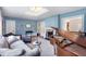 Cozy blue living room featuring hardwood floors, stylish decor, and comfortable seating at 711 Greenview Ne Ave, Atlanta, GA 30305