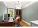 Cozy home office with hardwood floors, traditional furniture, natural light, and green wall paint at 711 Greenview Ne Ave, Atlanta, GA 30305