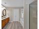 Bright bathroom features a double vanity, wood cabinets, and a separate tub and shower at 812 Roget Way, Lawrenceville, GA 30045