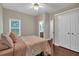 Bedroom with hardwood floors, natural light, walk-in closet and ensuite bathroom at 812 Roget Way, Lawrenceville, GA 30045