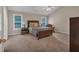Spacious bedroom with carpeted floors, natural light, and traditional furniture at 812 Roget Way, Lawrenceville, GA 30045