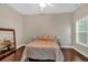 Cozy bedroom with hardwood floors, natural light, and neutral colors at 812 Roget Way, Lawrenceville, GA 30045