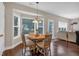 Eat-in dining room with hardwood floors, natural light, and traditional furniture at 812 Roget Way, Lawrenceville, GA 30045