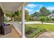 Inviting covered front porch with seating area, perfect for enjoying the neighborhood views at 812 Roget Way, Lawrenceville, GA 30045