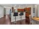 Open kitchen with breakfast bar, wood cabinets and hardwood floors at 812 Roget Way, Lawrenceville, GA 30045
