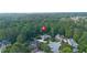 Community aerial view with tree-lined streets, manicured lawns, and charming single-Gathering homes at 1005 Cromwell Cv, Snellville, GA 30078