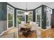 Charming breakfast nook boasts a round table, surrounded by large windows, for a bright and inviting space to enjoy meals at 1005 Cromwell Cv, Snellville, GA 30078