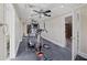 Well-lit exercise room featuring ceiling fans and various fitness machines for a complete workout at 1005 Cromwell Cv, Snellville, GA 30078