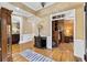 Spacious foyer with hardwood floors, showcasing seamless transition to the living room, den and a welcoming entrance at 1005 Cromwell Cv, Snellville, GA 30078