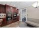 Modern kitchen with built-in ovens, dark wood cabinetry, and stylish countertops at 1005 Cromwell Cv, Snellville, GA 30078