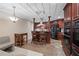 Open kitchen with counter seating, stainless appliances, and sleek dark cabinets at 1005 Cromwell Cv, Snellville, GA 30078