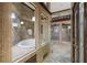 Opulent bathroom boasts a jetted tub, multiple showers, and decorative tile at 1005 Cromwell Cv, Snellville, GA 30078