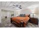 Relaxing bedroom with king bed and adjacent bathroom showcasing the gorgeous tile floor at 1005 Cromwell Cv, Snellville, GA 30078