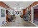 Spacious mud room with tiled flooring, shoe racks, and ample natural light at 1005 Cromwell Cv, Snellville, GA 30078