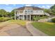 Beautiful rear view of the large home with upper deck, stairs, and professionally landscaped backyard at 1005 Cromwell Cv, Snellville, GA 30078