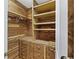 Cedar walk-in closet with drawers, shelves, and hanging rods at 1005 Cromwell Cv, Snellville, GA 30078