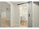 Bathroom with sliding barn door, a modern vanity and tile flooring at 1150 Nw Collier Rd # K24, Atlanta, GA 30318