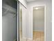 Ample closet space with double mirrored doors, shelving and tile flooring at 1150 Nw Collier Rd # K24, Atlanta, GA 30318