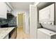 Well-maintained kitchen features modern appliances, washer, and dryer to maximize space and convenience at 1150 Nw Collier Rd # K24, Atlanta, GA 30318