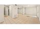 Bright living room with tile flooring, updated appliances, and access to other rooms and features at 1150 Nw Collier Rd # K24, Atlanta, GA 30318